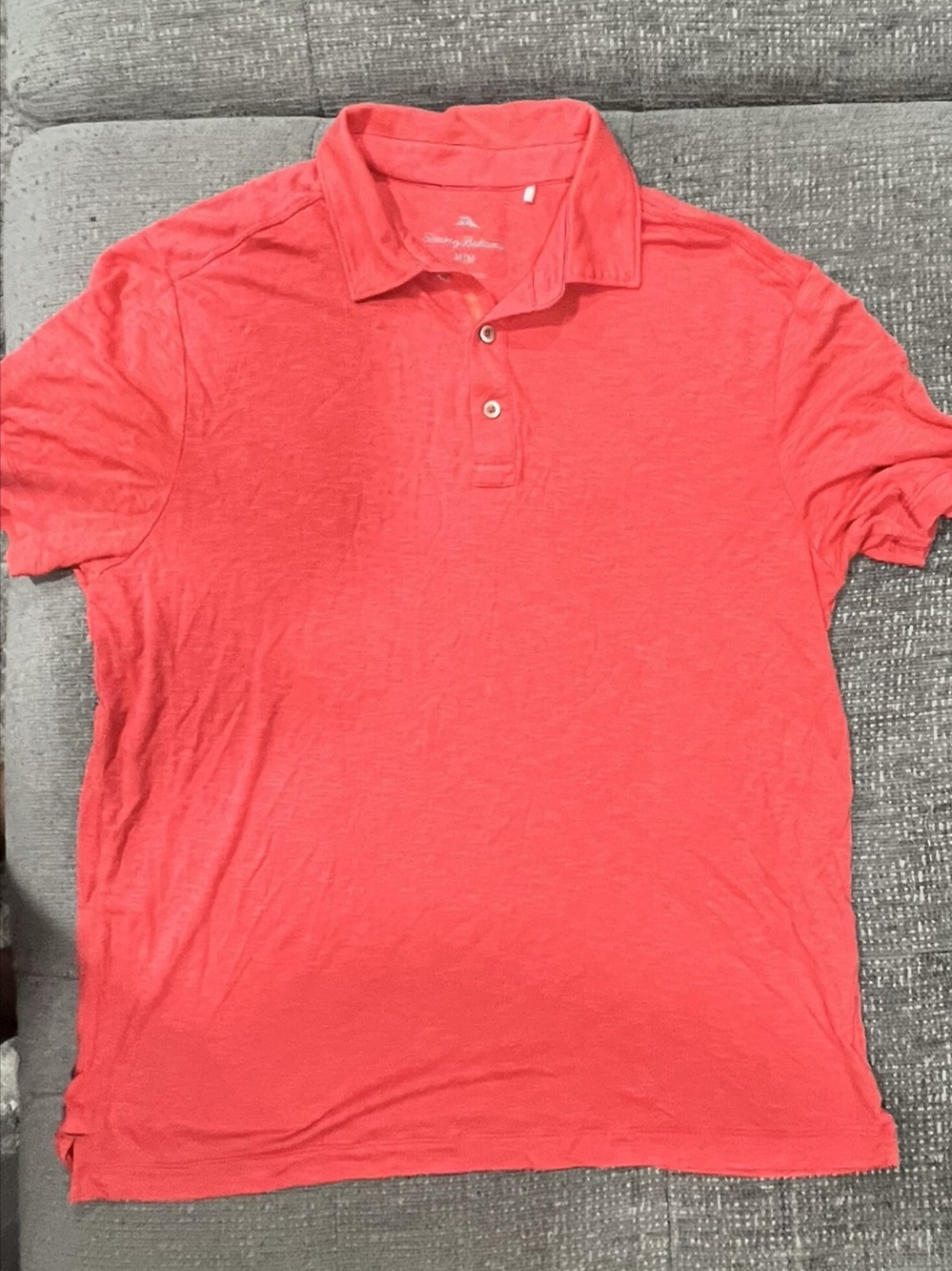 Tommy Bahama men's polo shirt in coral / salmon pink